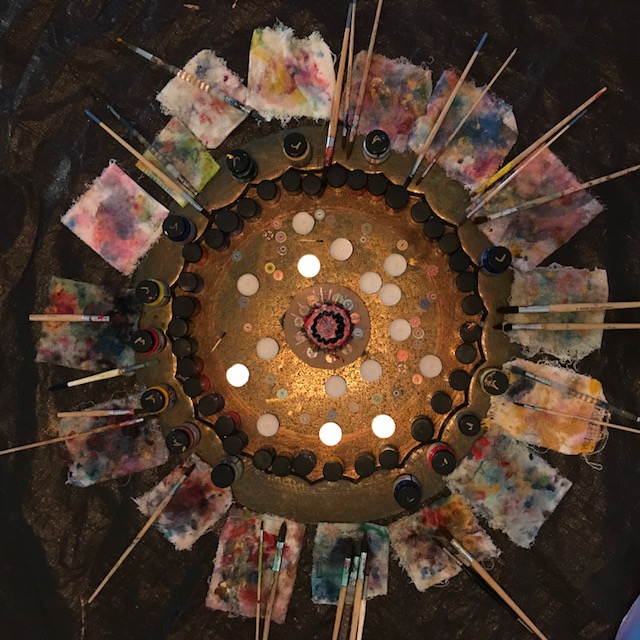A circular display of flags and candles in the center.
